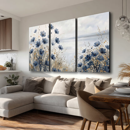 Soft blue flowers and ivory grasses beside a pale coastal horizon 3 piece canvas wall art room and product view