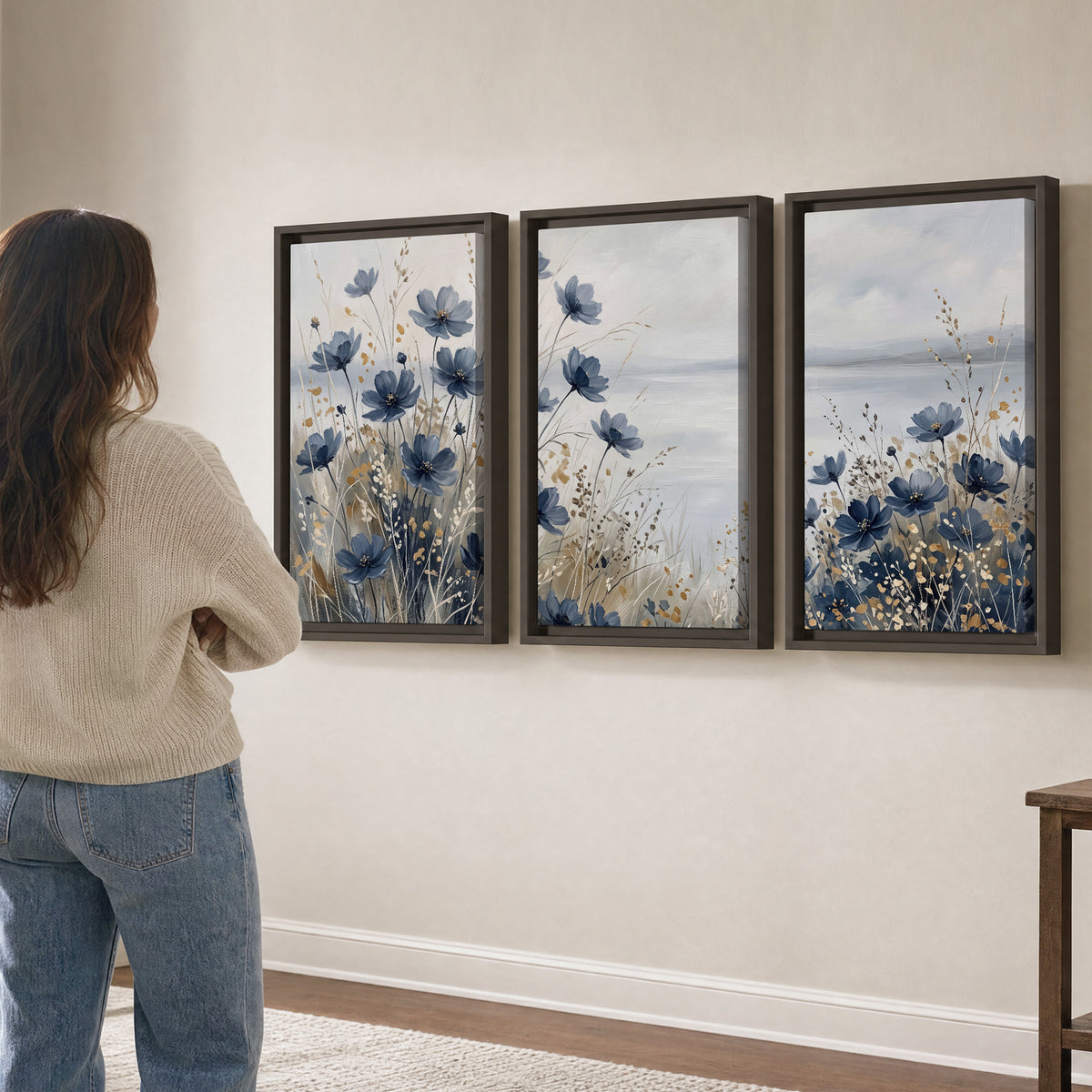 Soft blue flowers and ivory grasses beside a pale coastal horizon 3 piece framed canvas wall art three panel arrangement on a wall