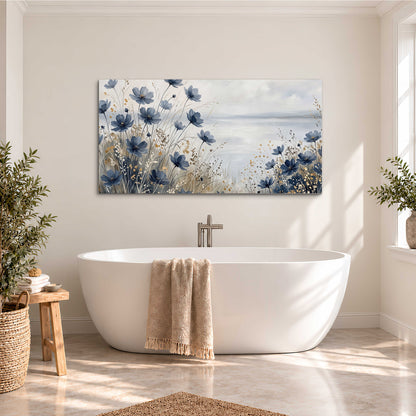 Soft blue flowers and ivory grasses beside a pale coastal horizon single canvas wall art styled in an interior