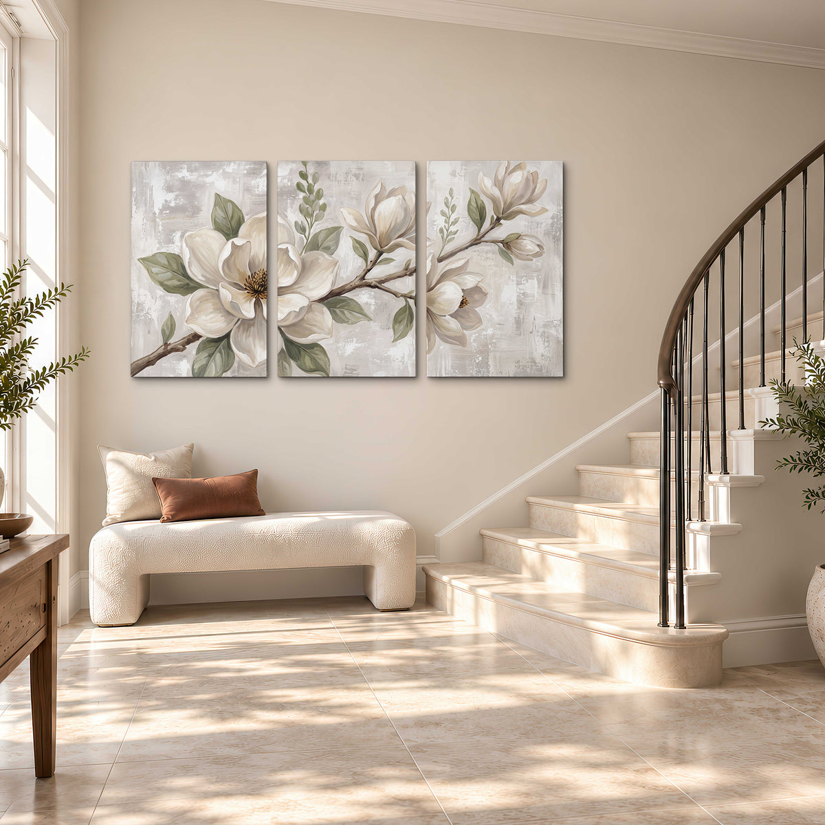 Large ivory magnolia blossoms and soft green leaves on pale gray 3 piece canvas wall art styled in an interior