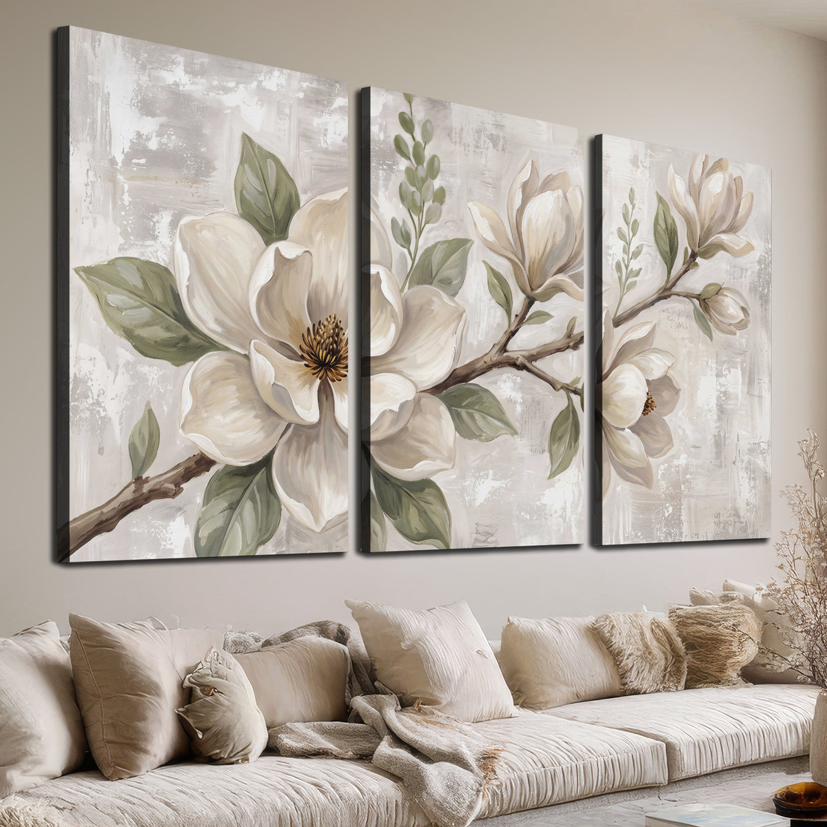 Large ivory magnolia blossoms and soft green leaves on pale gray 3 piece canvas wall art room and product view