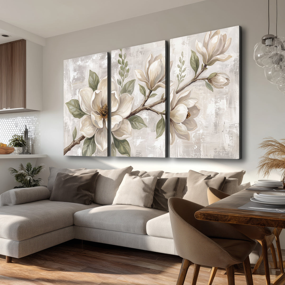 Large ivory magnolia blossoms and soft green leaves on pale gray 3 piece canvas wall art room and product view