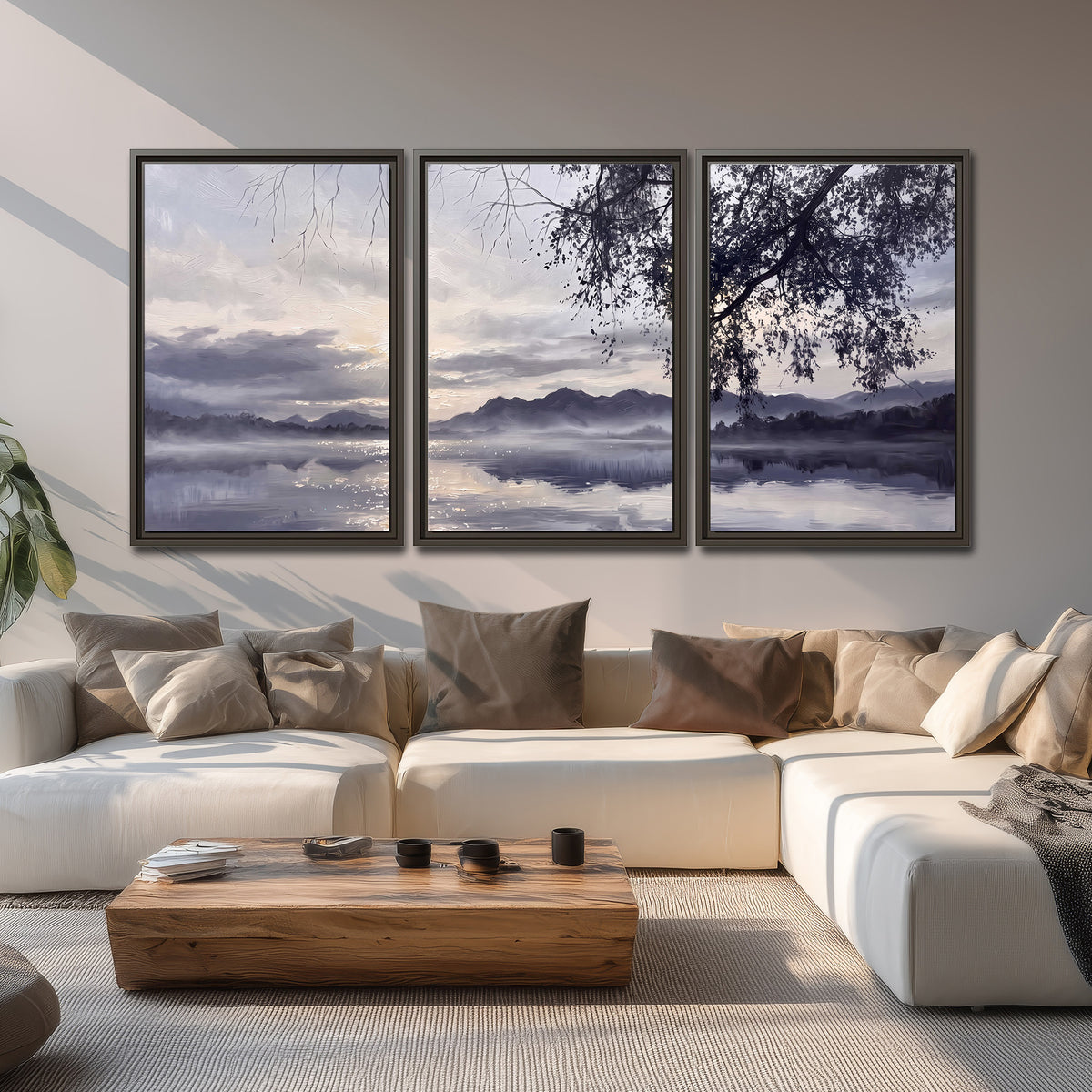 Quiet gray-blue water and dark overhanging branches beneath evening clouds 3 piece framed canvas wall art displayed in a living room