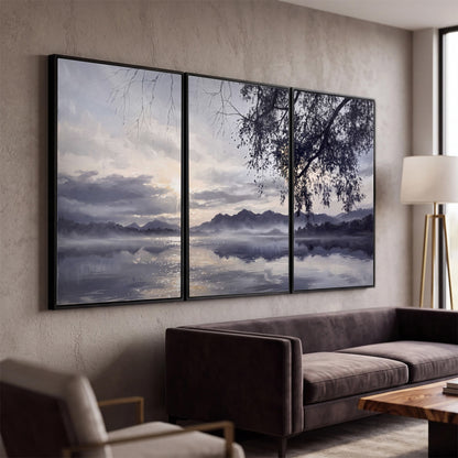 Quiet gray-blue water and dark overhanging branches beneath evening clouds 3 piece framed canvas wall art displayed in a modern living room