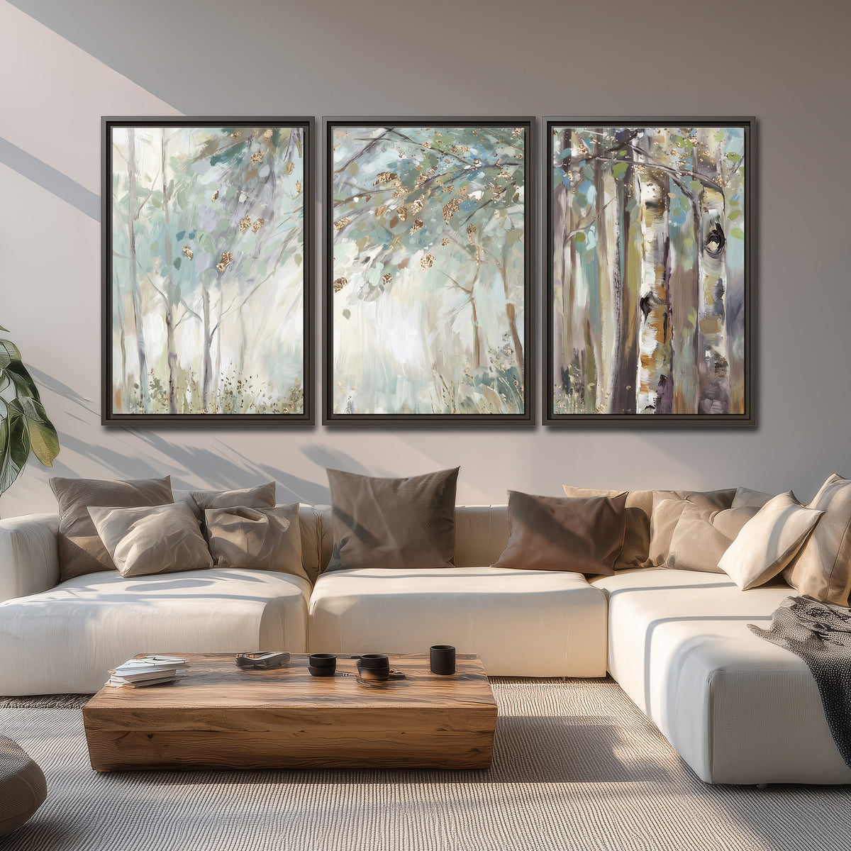 Slender woodland trunks and delicate branches in soft green and cream 3 piece framed canvas wall art displayed in a living room