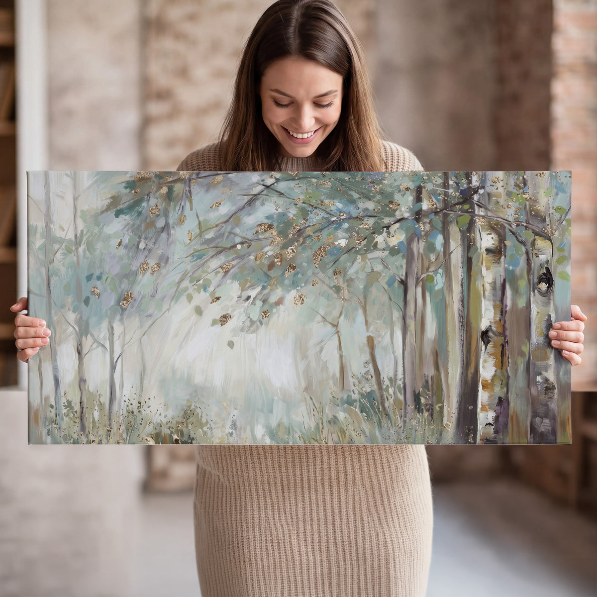 Slender woodland trunks and delicate branches in soft green and cream single canvas wall art held in hands