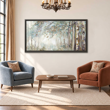 Slender woodland trunks and delicate branches in soft green and cream single framed canvas wall art styled in an interior