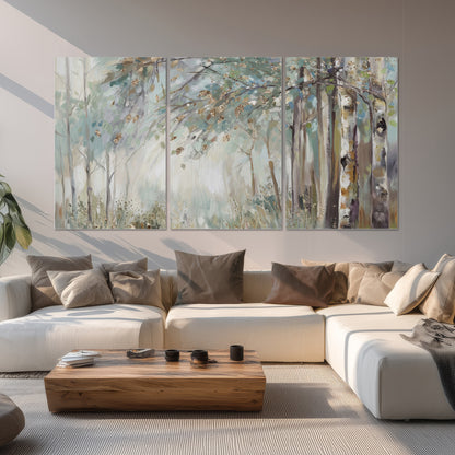 Slender woodland trunks and delicate branches in soft green and cream set of 3 poster prints displayed in a living room
