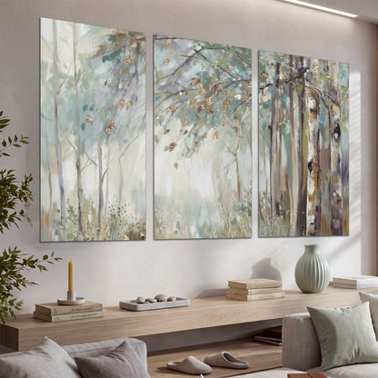 Slender woodland trunks and delicate branches in soft green and cream set of 3 poster prints displayed in a console