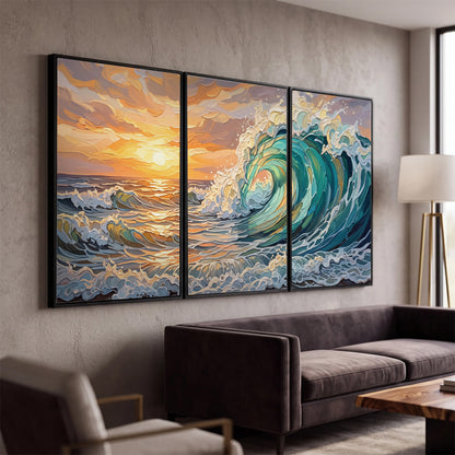 A curling turquoise ocean wave beneath a warm orange sunset 3 piece framed canvas wall art displayed in a modern living room