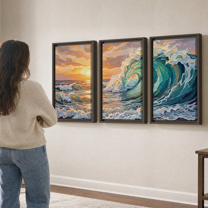 A curling turquoise ocean wave beneath a warm orange sunset 3 piece framed canvas wall art three panel arrangement on a wall