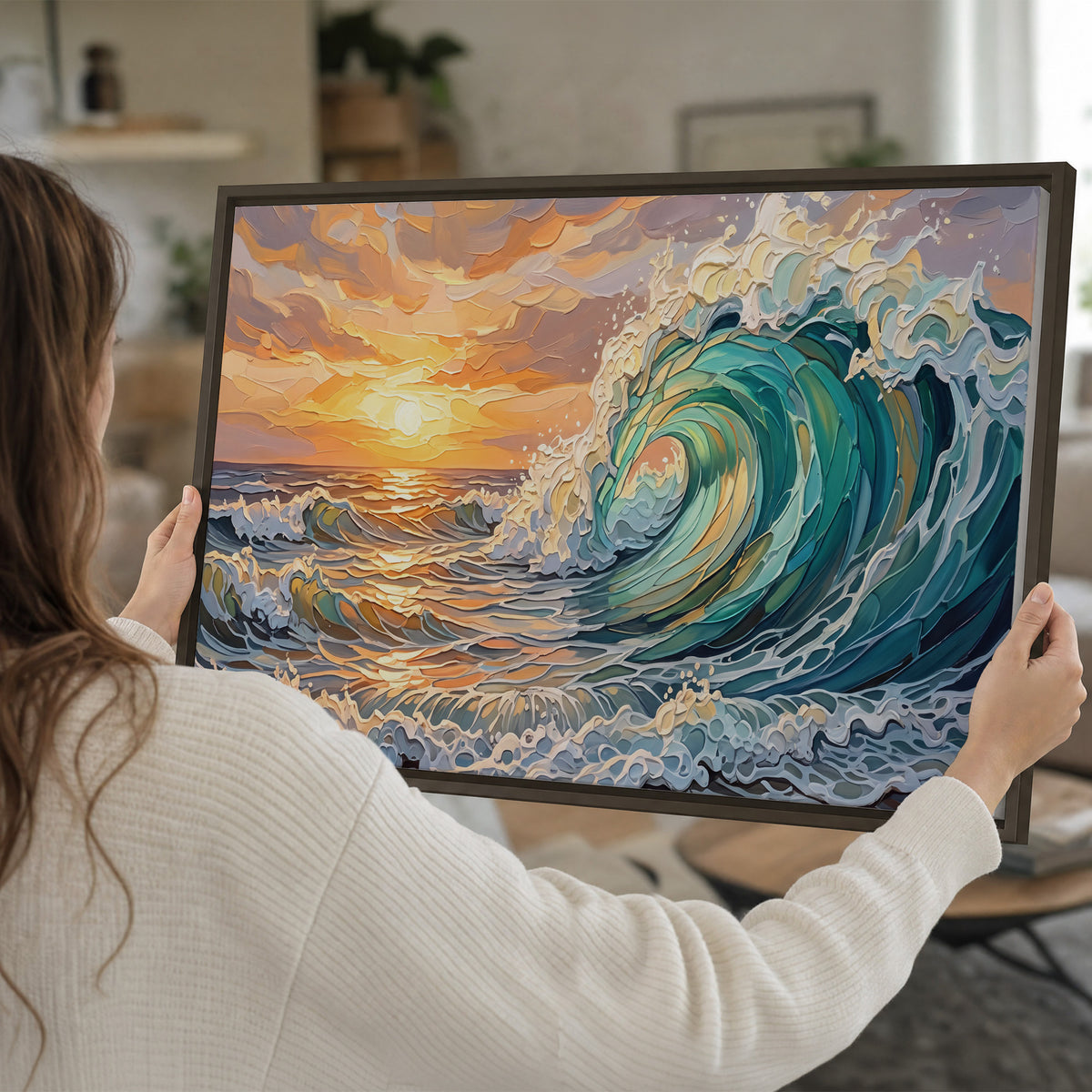 A curling turquoise ocean wave beneath a warm orange sunset single framed canvas wall art held in hands