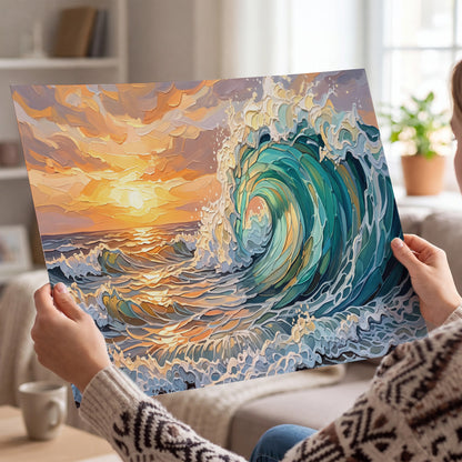 A curling turquoise ocean wave beneath a warm orange sunset single poster print held in hands