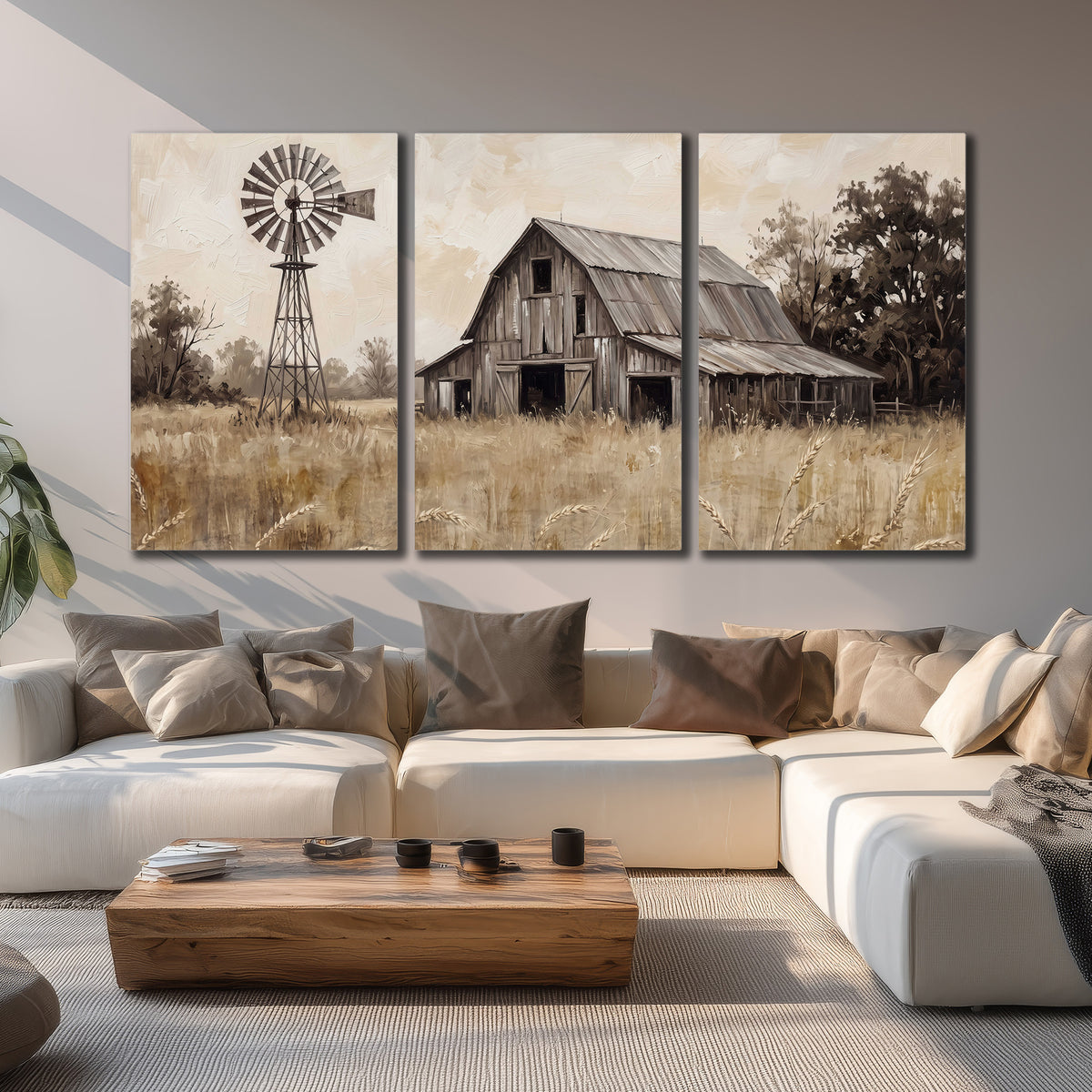 A weathered wooden barn and windmill in a golden country field 3 piece canvas wall art displayed in a living room
