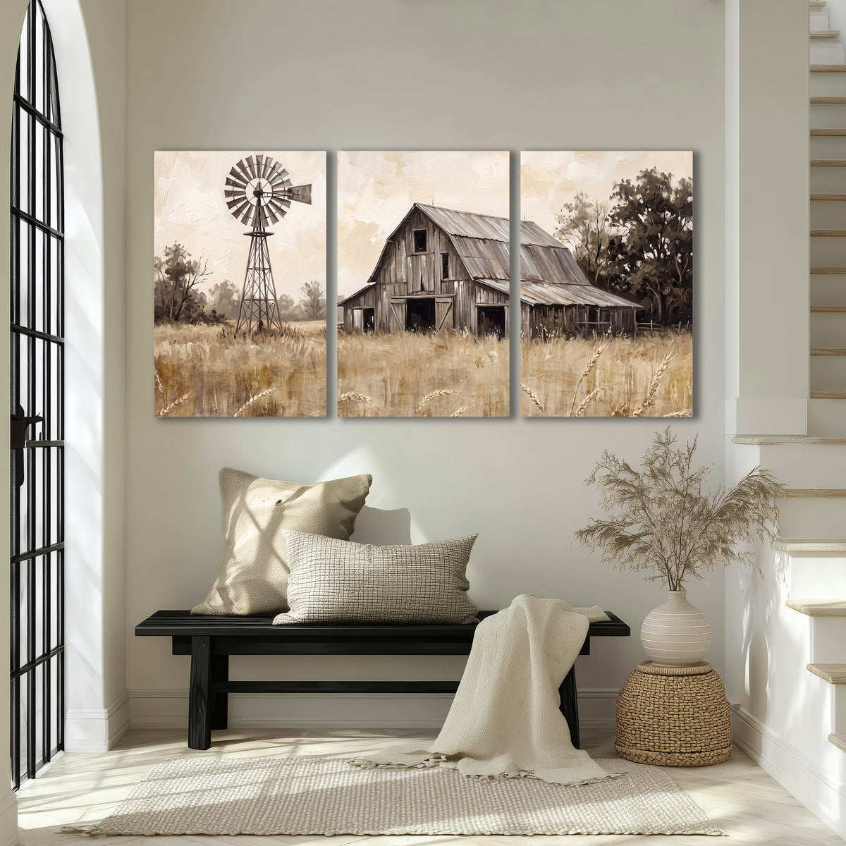 A weathered wooden barn and windmill in a golden country field 3 piece canvas wall art displayed in a entryway