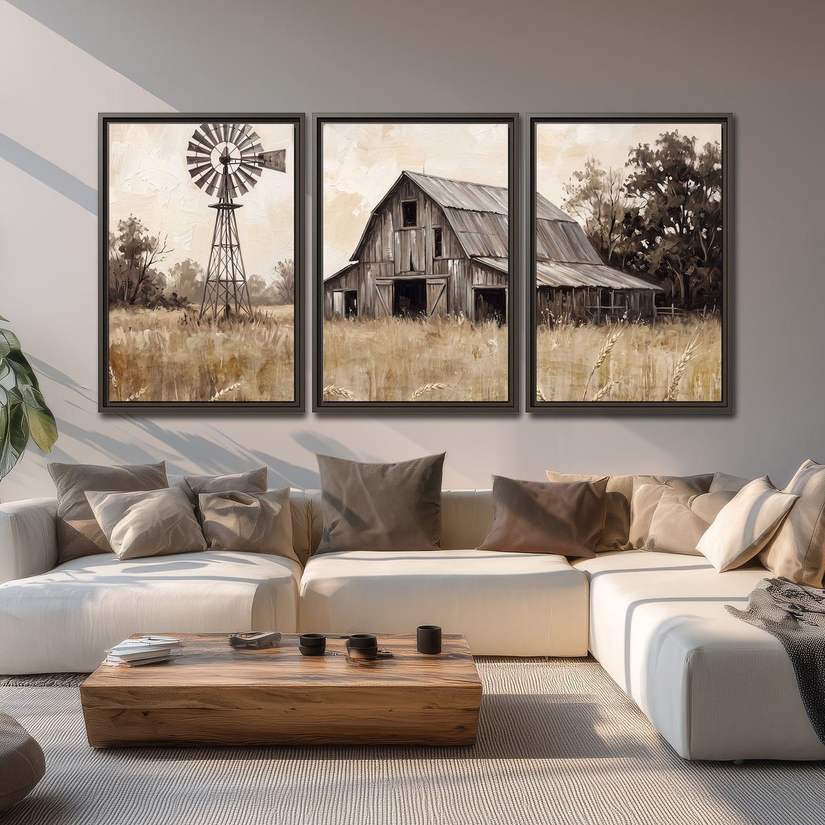 A weathered wooden barn and windmill in a golden country field 3 piece framed canvas wall art displayed in a living room