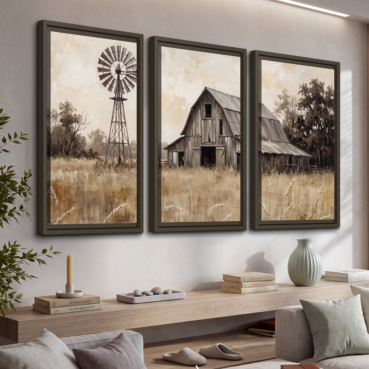 A weathered wooden barn and windmill in a golden country field 3 piece framed canvas wall art displayed in a console