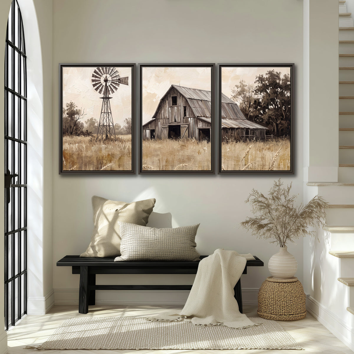 A weathered wooden barn and windmill in a golden country field 3 piece framed canvas wall art displayed in a entryway