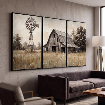 A weathered wooden barn and windmill in a golden country field 3 piece framed canvas wall art displayed in a modern living room