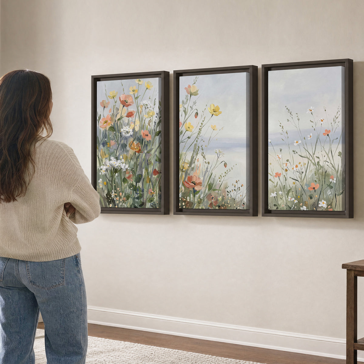 Small colorful wildflowers and light grasses beside a pale lake 3 piece framed canvas wall art three panel arrangement on a wall