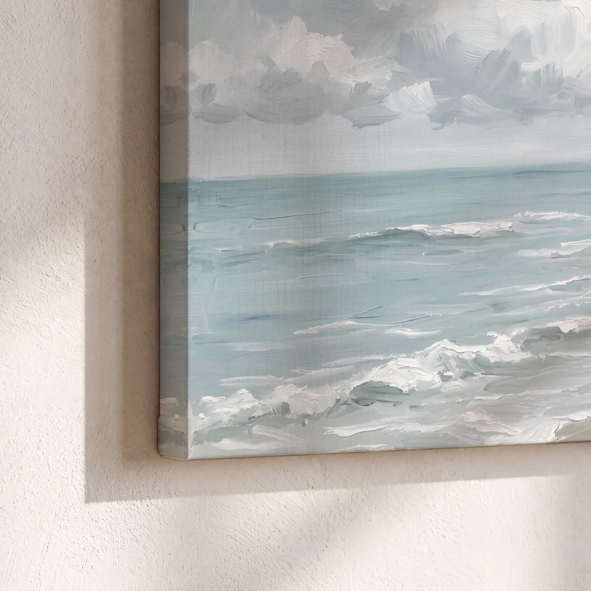 Gentle pale blue waves washing across a light sandy beach 3 piece canvas wall art material and edge close up