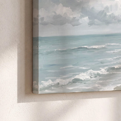 Gentle pale blue waves washing across a light sandy beach 3 piece canvas wall art material and edge close up