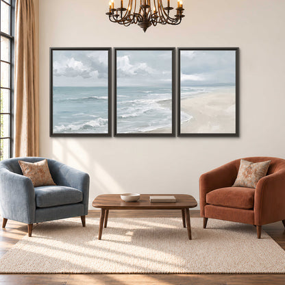 Gentle pale blue waves washing across a light sandy beach 3 piece framed canvas wall art styled in an interior