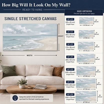 Gentle pale blue waves washing across a light sandy beach single canvas wall art size guide above a sofa; room view is illustrative