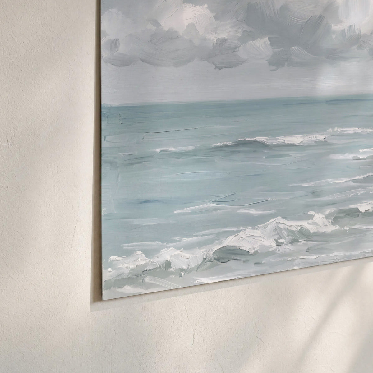 Gentle pale blue waves washing across a light sandy beach set of 3 poster prints material and edge close up