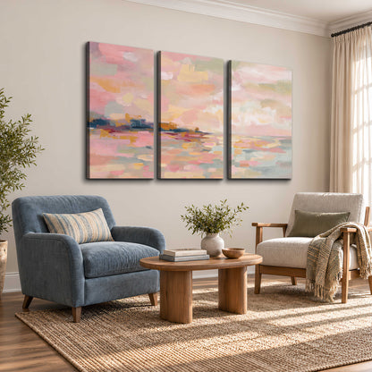 Pink, peach and yellow painted-style sky and water reflections 3 piece canvas wall art styled in an interior