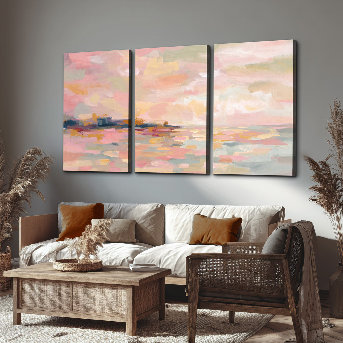 Pink, peach and yellow painted-style sky and water reflections 3 piece canvas wall art displayed in a rustic living room