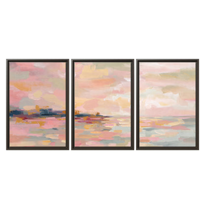 Pink, peach and yellow painted-style sky and water reflections 3 piece framed canvas wall art viewed straight on