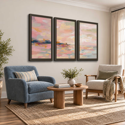 Pink, peach and yellow painted-style sky and water reflections 3 piece framed canvas wall art styled in an interior