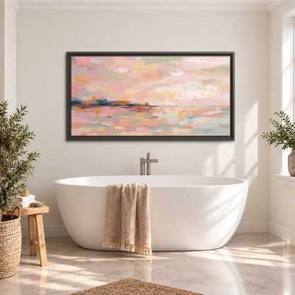 Pink, peach and yellow painted-style sky and water reflections single framed canvas wall art styled in an interior