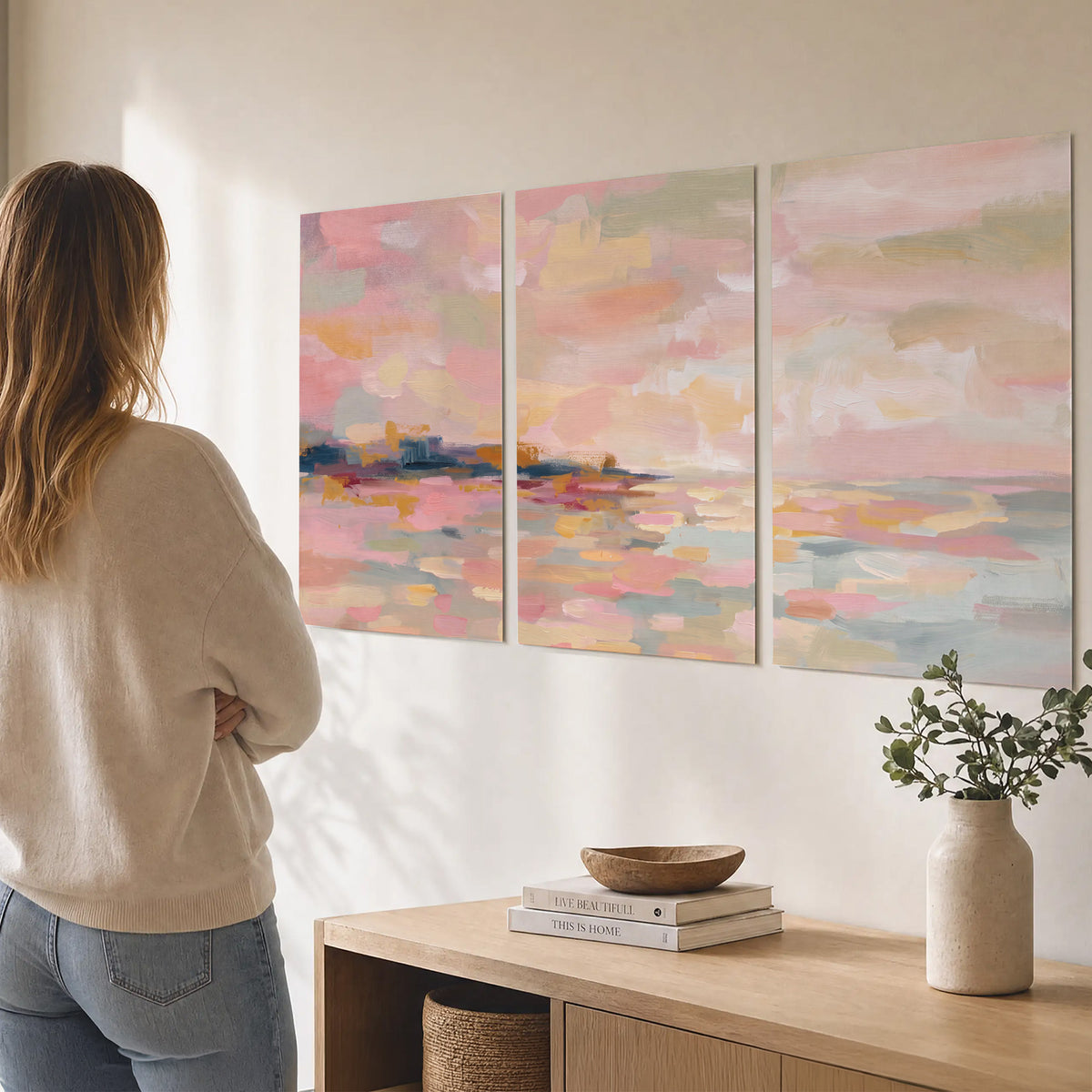 Pink, peach and yellow painted-style sky and water reflections set of 3 poster prints three panel arrangement on a wall