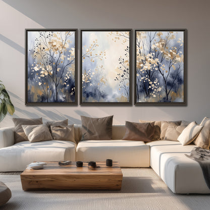 Delicate pale gold-colored branches against a deep blue misty background 3 piece framed canvas wall art displayed in a living room