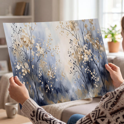 Delicate pale gold-colored branches against a deep blue misty background single poster print held in hands
