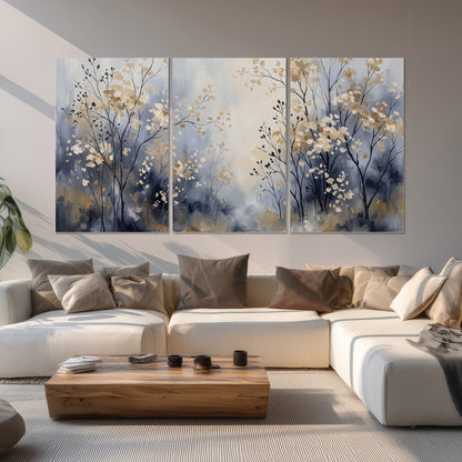 Delicate pale gold-colored branches against a deep blue misty background set of 3 poster prints displayed in a living room
