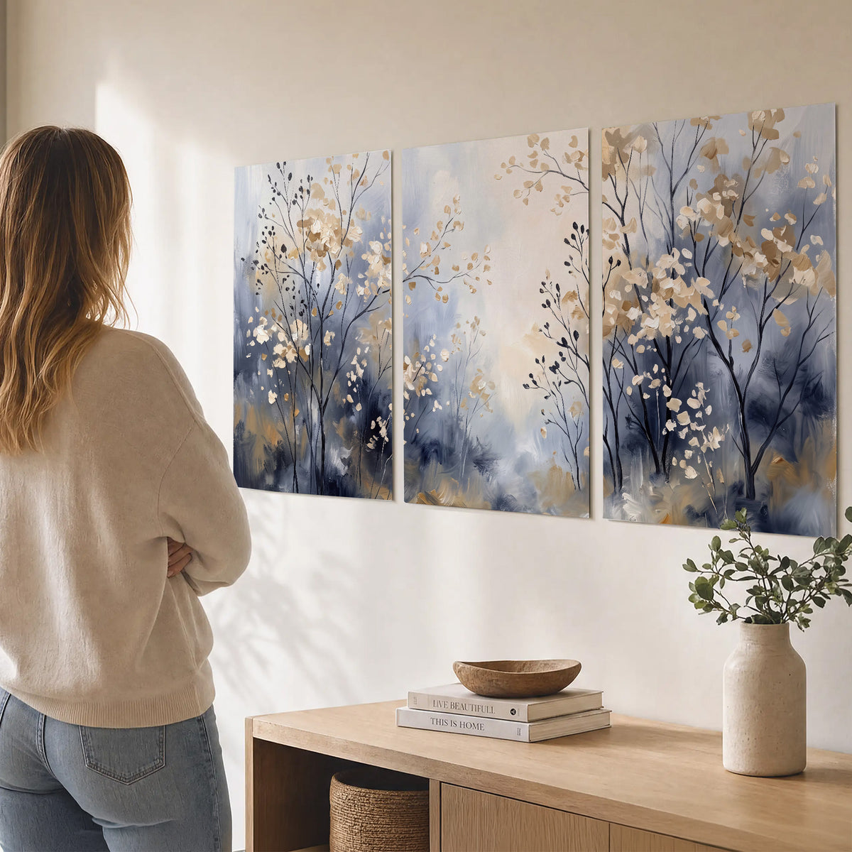 Delicate pale gold-colored branches against a deep blue misty background set of 3 poster prints three panel arrangement on a wall