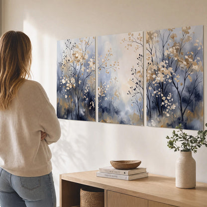 Delicate pale gold-colored branches against a deep blue misty background set of 3 poster prints three panel arrangement on a wall