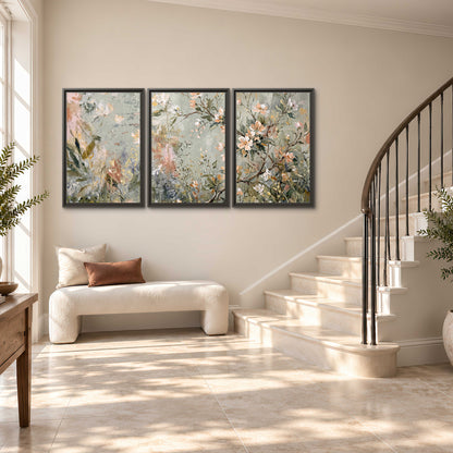 Delicate pink and ivory flowering branches against muted sage green 3 piece framed canvas wall art styled in an interior