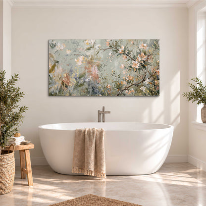 Delicate pink and ivory flowering branches against muted sage green single canvas wall art styled in an interior