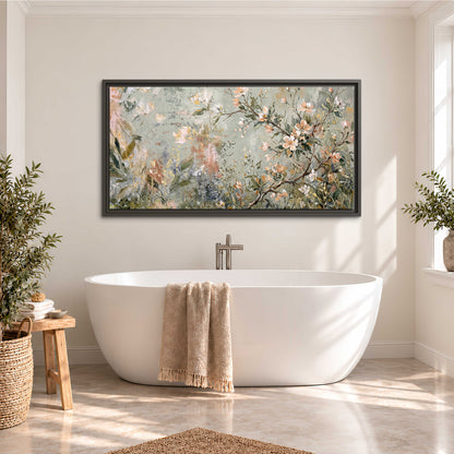 Delicate pink and ivory flowering branches against muted sage green single framed canvas wall art styled in an interior