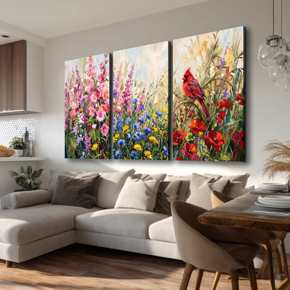 A bright red cardinal among vivid pink, blue and yellow wildflowers 3 piece canvas wall art room and product view