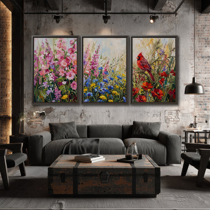 A bright red cardinal among vivid pink, blue and yellow wildflowers 3 piece framed canvas wall art displayed in a industrial room
