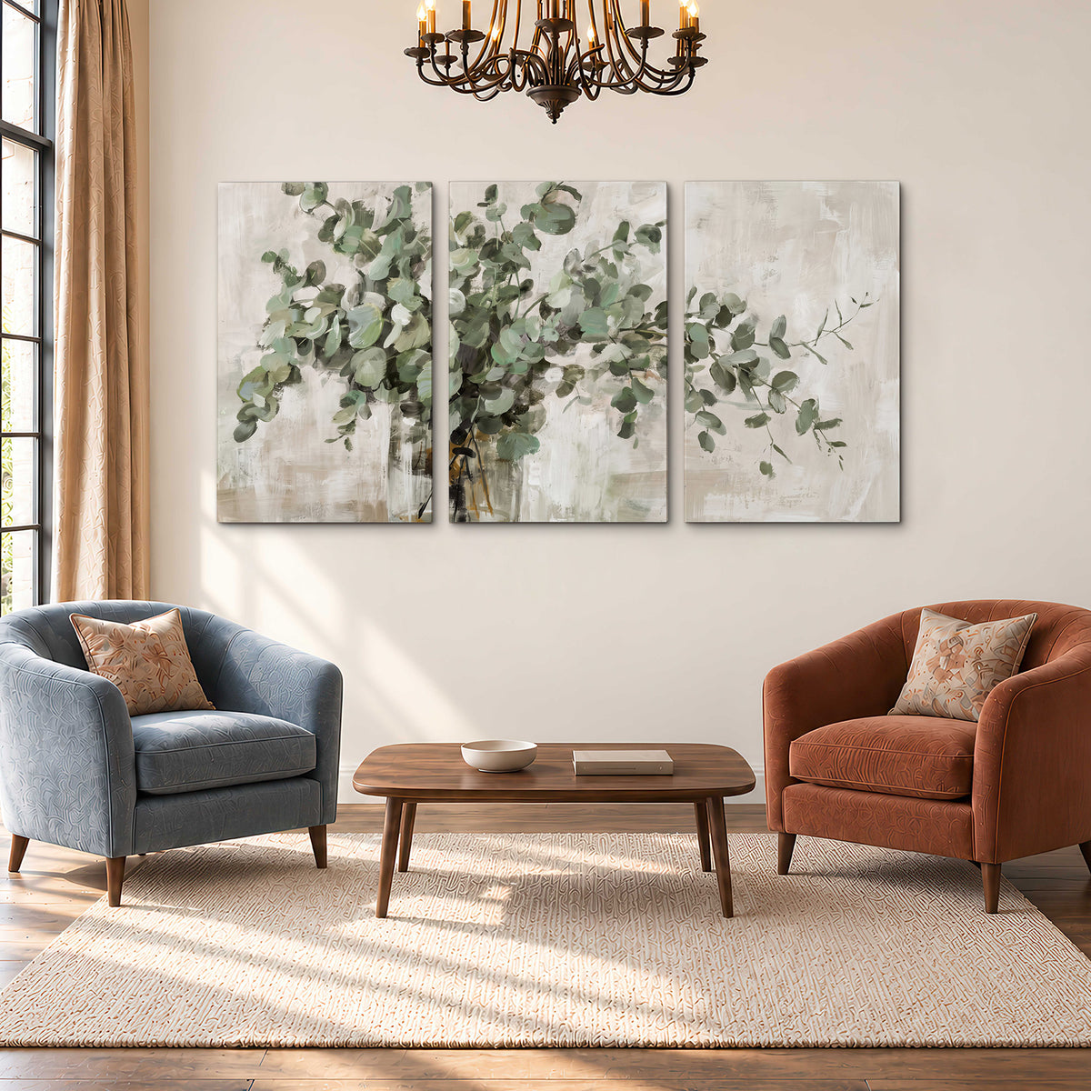 Soft sage eucalyptus leaves and pale stems on a warm cream background 3 piece canvas wall art styled in an interior