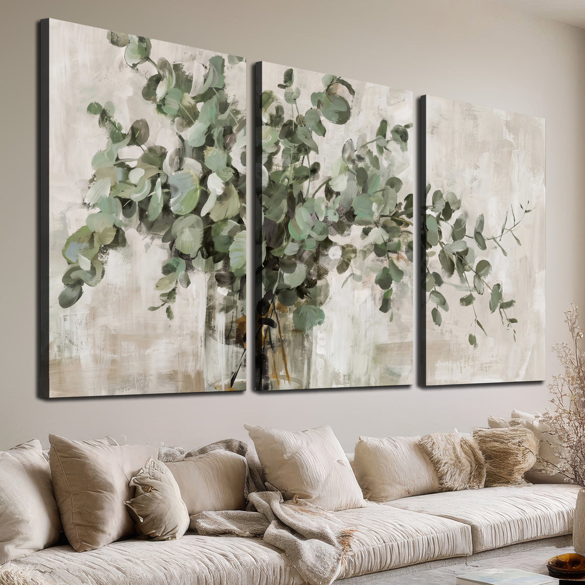 Soft sage eucalyptus leaves and pale stems on a warm cream background 3 piece canvas wall art room and product view