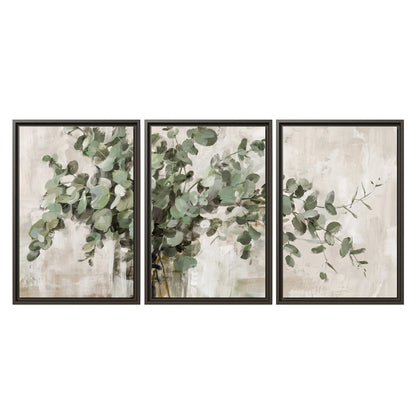 Soft sage eucalyptus leaves and pale stems on a warm cream background 3 piece framed canvas wall art viewed straight on