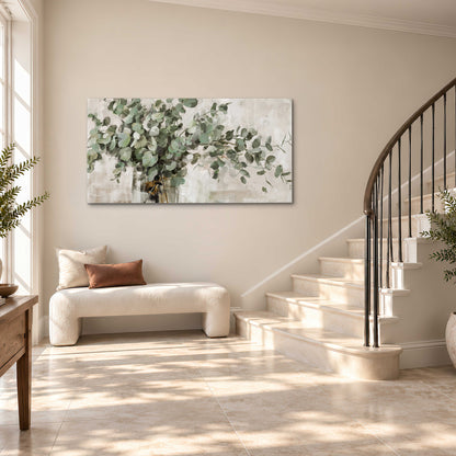 Soft sage eucalyptus leaves and pale stems on a warm cream background single canvas wall art styled in an interior
