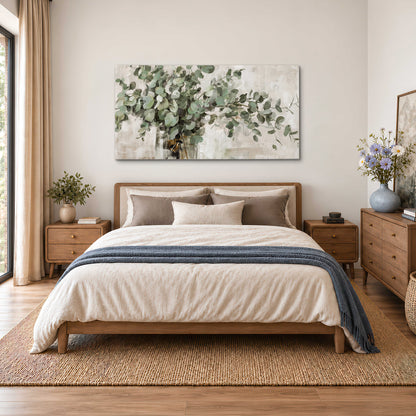 Soft sage eucalyptus leaves and pale stems on a warm cream background single canvas wall art styled in an interior